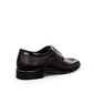 Sun Masiha black leather lace-up formal shoe with subtle handmade stitching and rubber outsole. Photo of back view at a side angle.