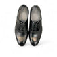 Sun Masiha black leather lace-up formal shoe with subtle handmade stitching and rubber outsole. Photo of upper view.