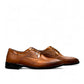 Sun Masiha brown leather lace-up dress shoe with brogue detailing and a durable rubber outsole. Photo of side views.