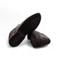Sun Pourya black leather lace-up dress shoe with a durable rubber outsole and textured toe detail. Photo of bottom view.