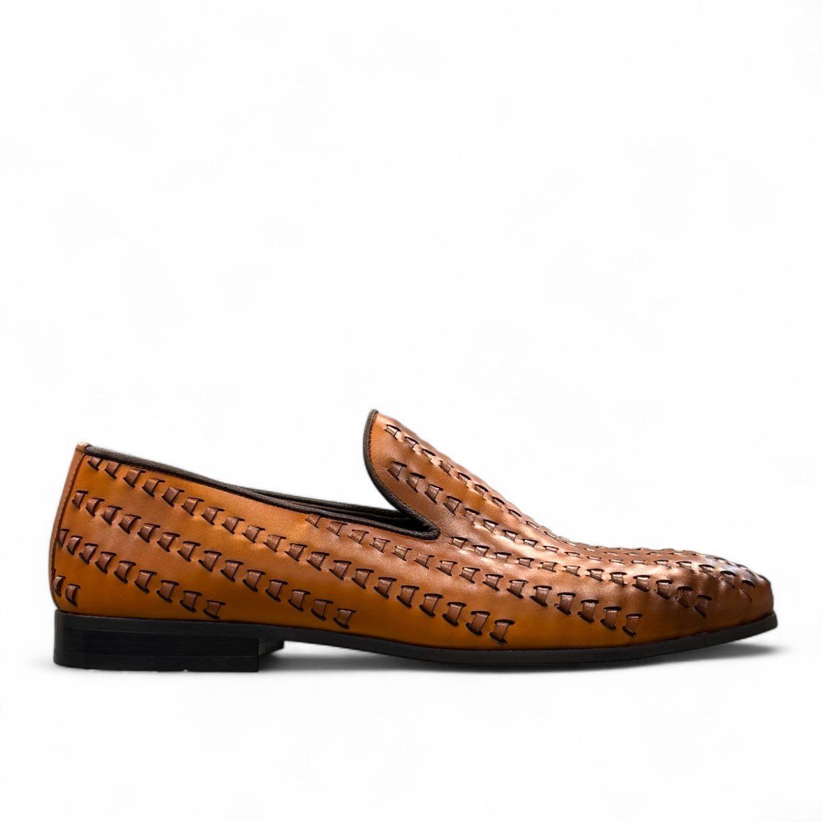 Sun Roniya brown leather loafers featuring intricate handmade stitching and a durable rubber outsole. Photo of outside side view.