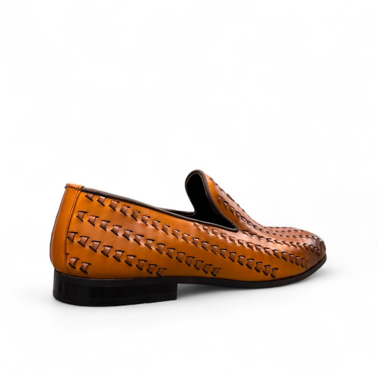 Sun Roniya brown leather loafers featuring intricate handmade stitching and a durable rubber outsole. Photo of back view from side angle.