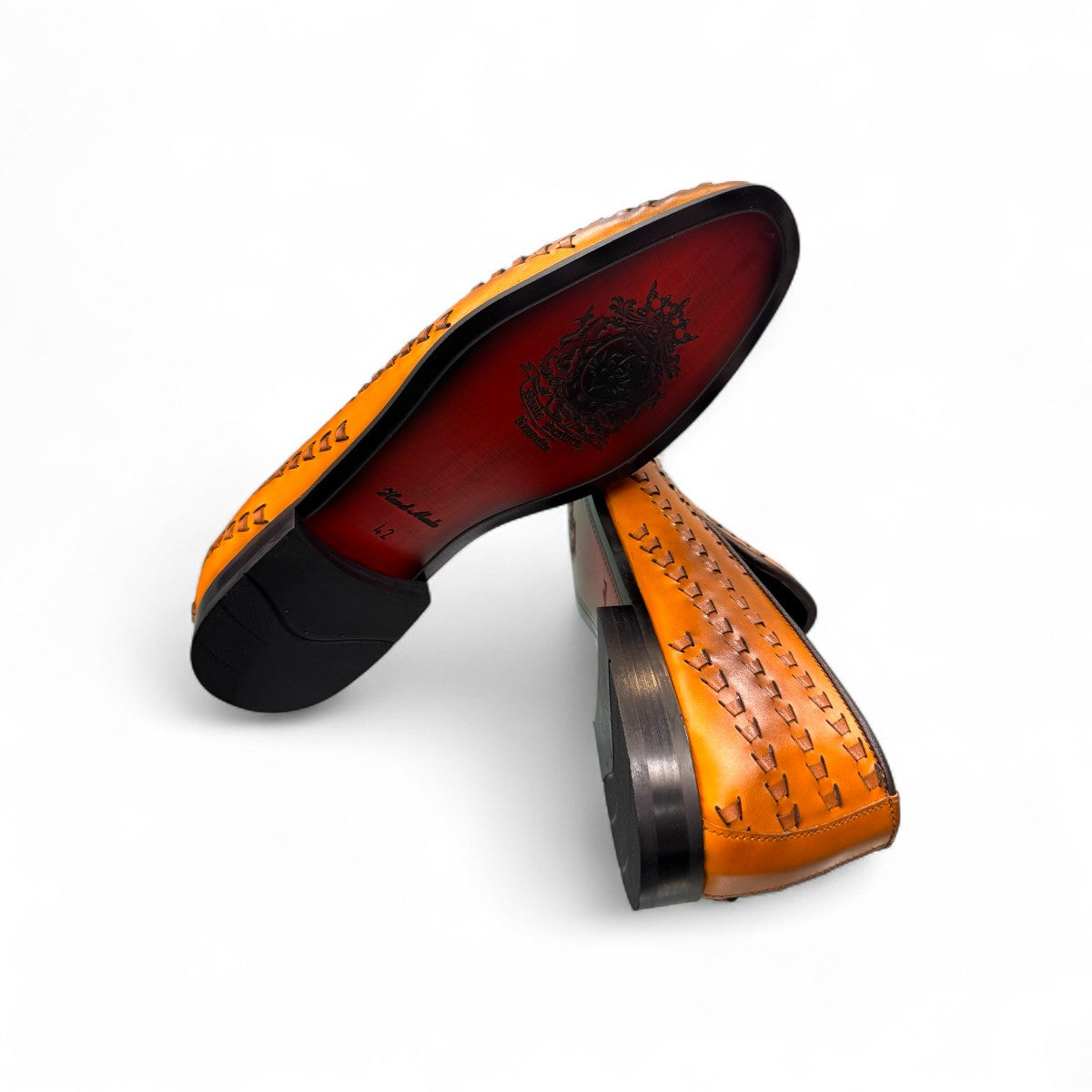 Sun Roniya brown leather loafers featuring intricate handmade stitching and a durable rubber outsole. Photo of bottom view.