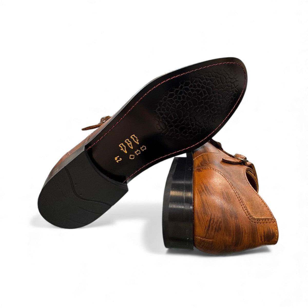 Sun Sahra brown leather monk strap shoe with handmade stitching and a durable rubber outsole. Photo of bottom view.
