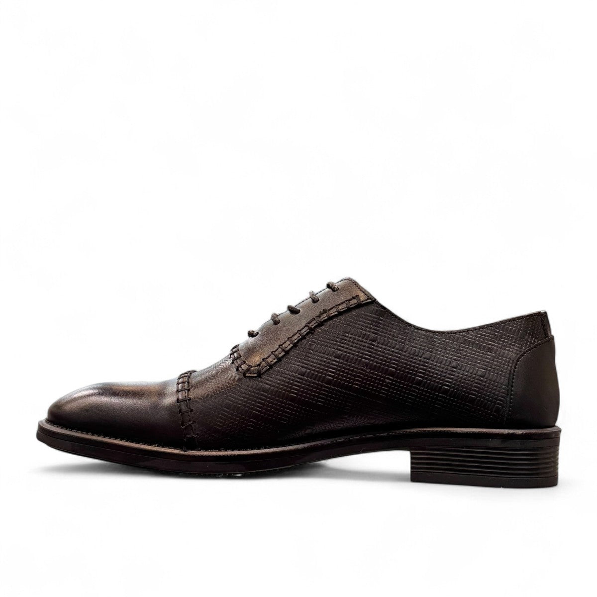 Sun Stylish black leather lace up dress shoe with textured pattern and handmade stitching details. Photo of inside side view.