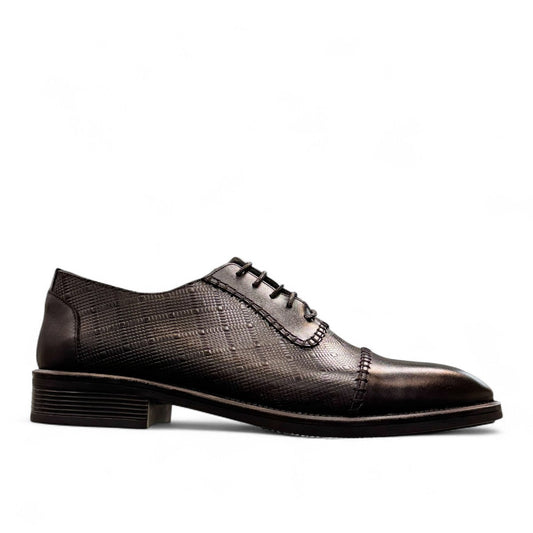 Sun Stylish black leather lace up dress shoe with textured pattern and handmade stitching details. Photo of outside side view.