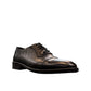 Sun Stylish black leather lace up dress shoe with textured pattern and handmade stitching details. Photo of front view from a side angle.