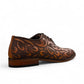 Sun Termeh brown leather and suede lace-up dress shoe with intricate hand-stitched swirl patterns. Photo of back view from side angle.