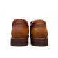TATA brown leather slip-on shoes with handmade stitching and durable rubber outsole for formal wear.