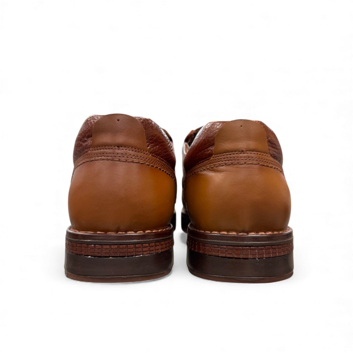 TATA brown leather slip-on shoes with handmade stitching and durable rubber outsole for formal wear.