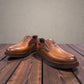 TATA brown leather slip-on shoes with handmade stitching and durable rubber outsole for formal wear.