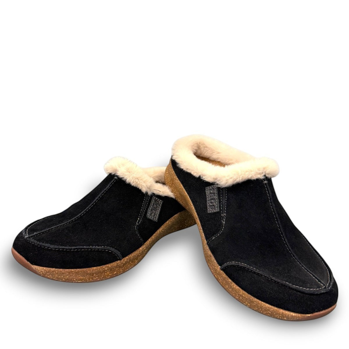 Taos Future black suede clog with soft faux fur lining and a supportive cork and EVA midsole. Photo of front view.