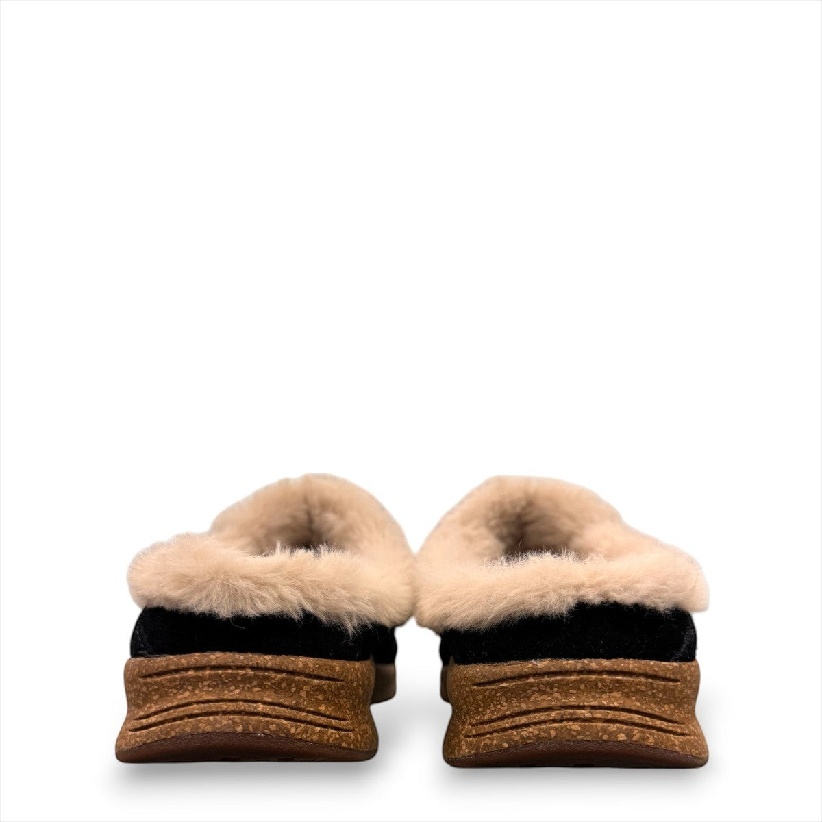 Taos Future black suede clog with soft faux fur lining and a supportive cork and EVA midsole. Photo of back view.