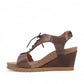 Taos Tie Wish espresso brown leather wedge sandal with T-strap, lace-up detail, and cork-style midsole. Photo of inside side view.