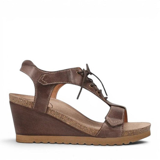 Taos Tie Wish espresso brown leather wedge sandal with T-strap, lace-up detail, and cork-style midsole. Photo of outside side view.
