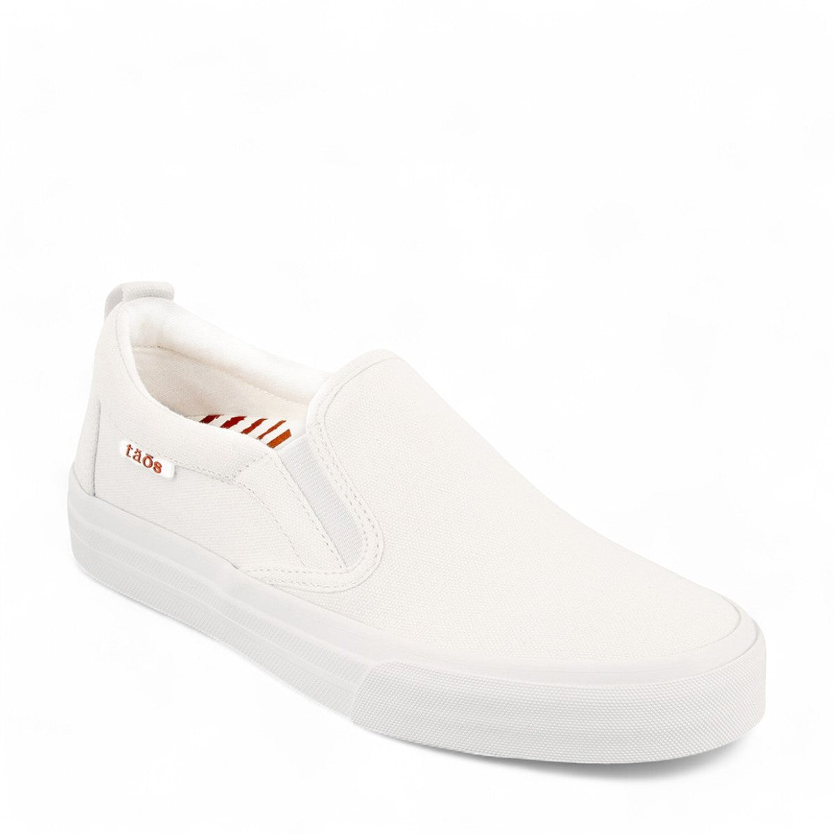 Taos Rubber Soul white canvas slip-on sneaker with platform sole and elastic gore. Photo of front view.
