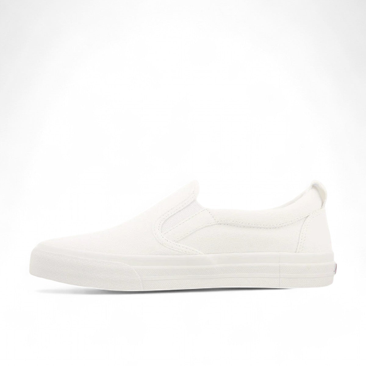 Taos Rubber Soul white canvas slip-on sneaker with platform sole and elastic gore. Photo of inside side view.