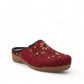 Taos Woolderness 2 cranberry wool clog with floral embroidery, faux fur lining, and cork midsole. Photo of front view.