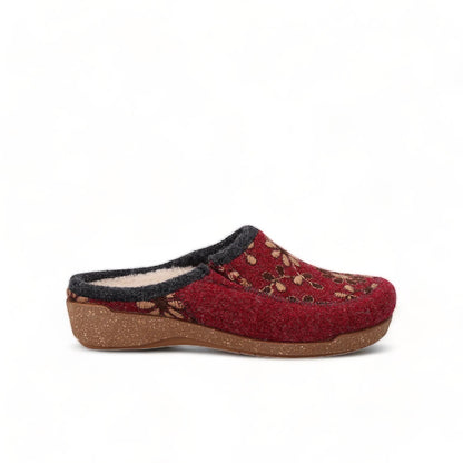 Taos Woolderness 2 cranberry wool clog with floral embroidery, faux fur lining, and cork midsole. Photo of left side view.