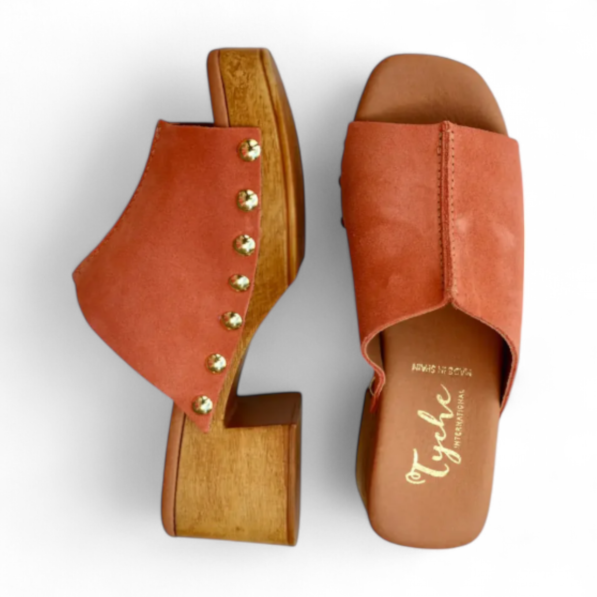 Tyche Bella coral leather slip-on clog with gold rivet accents and a wooden block heel. Photo of upper view.