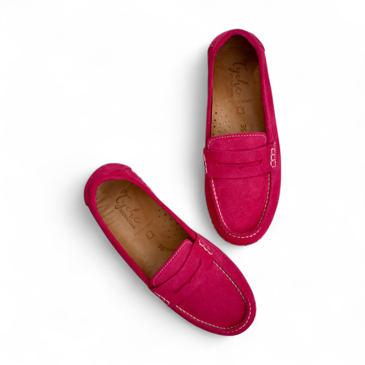 Tyche Mavis fuchsia suede loafers with white contrast stitching and a comfortable slip-on design.