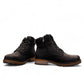 Wanderlust black ankle boot with faux leather, chunky knit cuff, side zipper, and lugged sole for winter comfort.