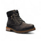 Wanderlust black ankle boot with faux leather, chunky knit cuff, side zipper, and lugged sole for winter comfort.
