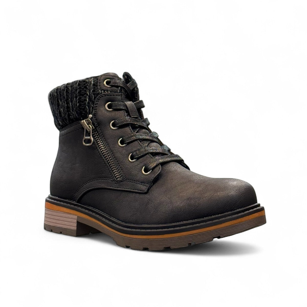 Wanderlust black ankle boot with faux leather, chunky knit cuff, side zipper, and lugged sole for winter comfort.