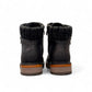 Wanderlust black ankle boot with faux leather, chunky knit cuff, side zipper, and lugged sole for winter comfort.
