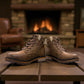 Wanderlust ankle boot in brown faux leather with a chunky knit cuff, side zipper, and lugged sole.