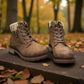 Wanderlust ankle boot in brown faux leather with a chunky knit cuff, side zipper, and lugged sole.
