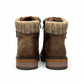 Wanderlust ankle boot in brown faux leather with a chunky knit cuff, side zipper, and lugged sole.