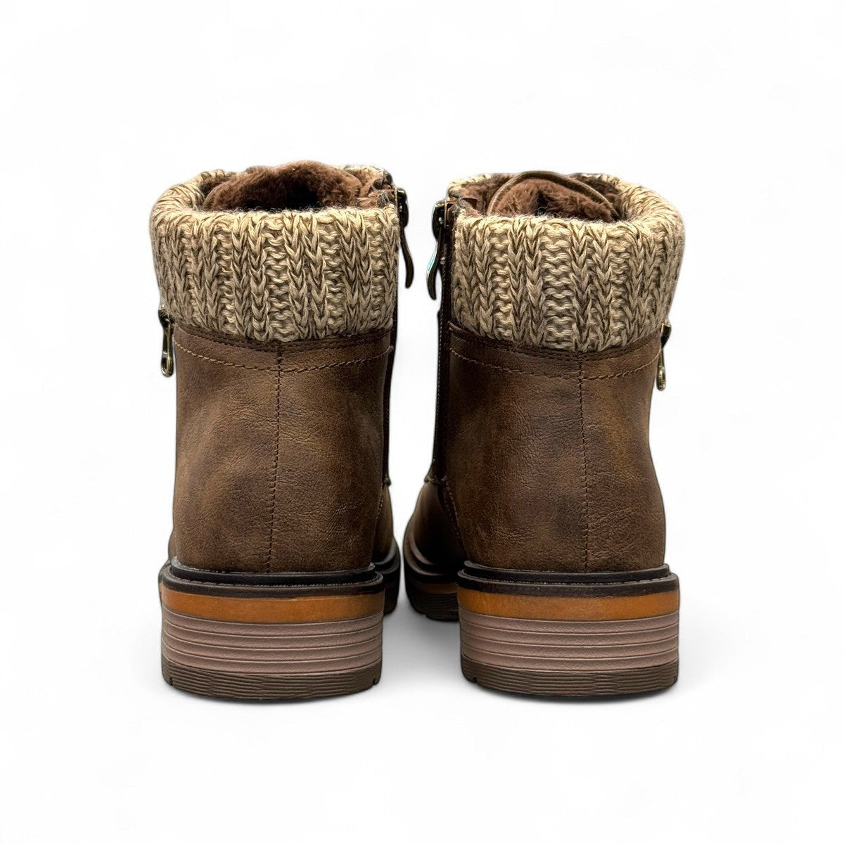 Wanderlust ankle boot in brown faux leather with a chunky knit cuff, side zipper, and lugged sole.