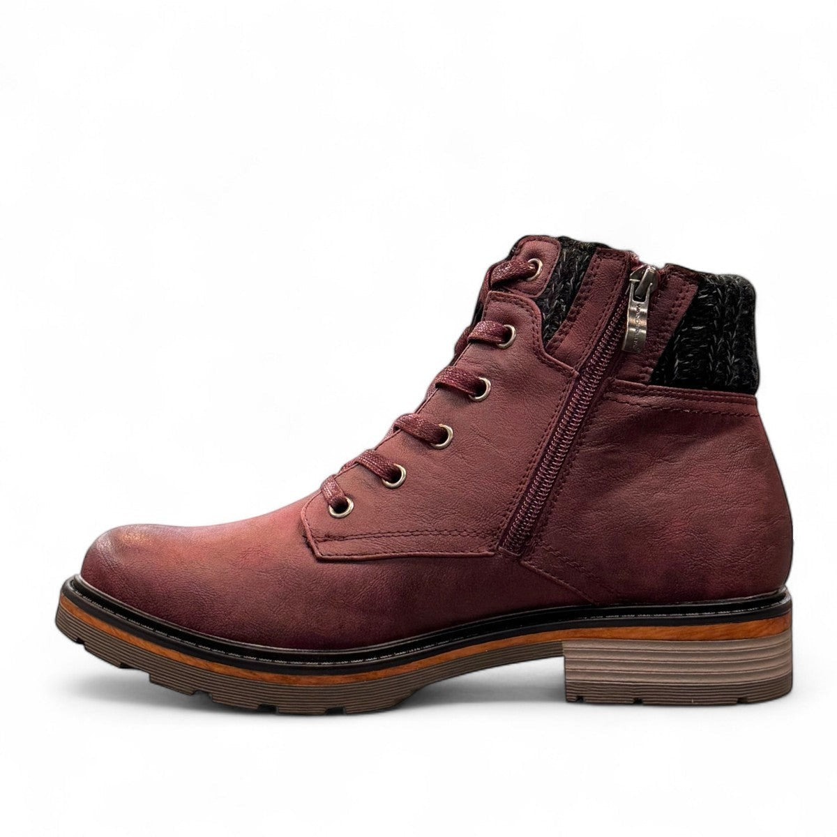 Wanderlust  burgundy faux leather ankle boot with a chunky knit cuff, side zipper, lace-up front, and lugged sole.