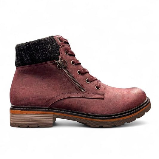 Wanderlust  burgundy faux leather ankle boot with a chunky knit cuff, side zipper, lace-up front, and lugged sole.