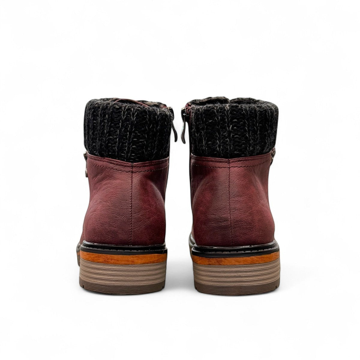 Wanderlust  burgundy faux leather ankle boot with a chunky knit cuff, side zipper, lace-up front, and lugged sole.