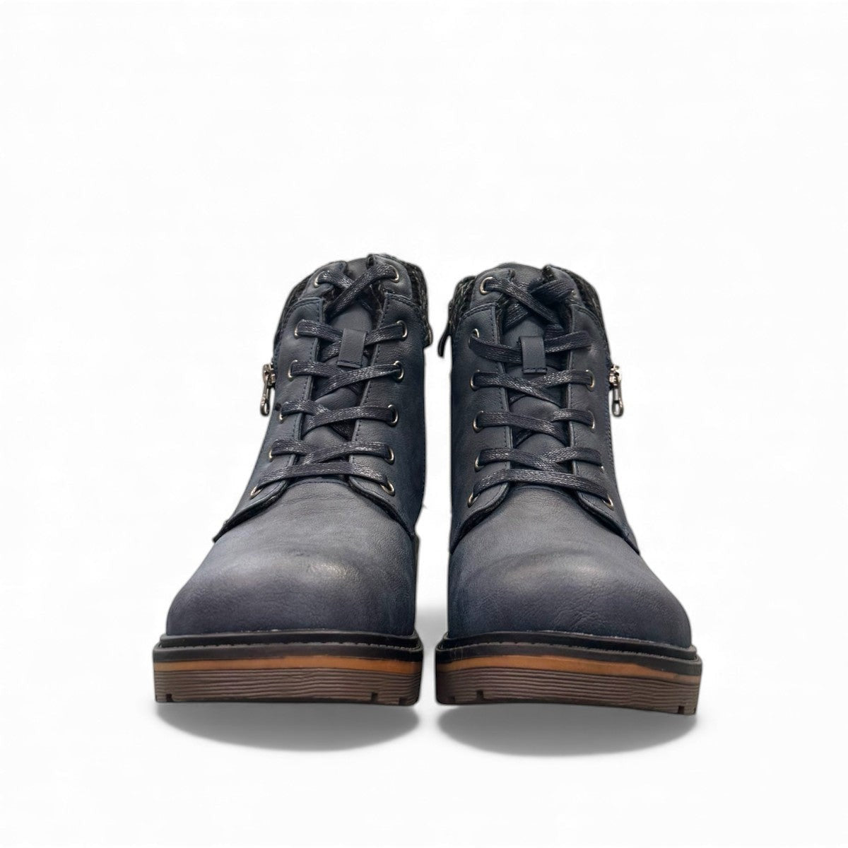 Wanderlust navy ankle boot with faux leather, chunky knit cuff, side zipper, lace-up closure, and lugged sole.