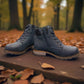 Wanderlust navy ankle boot with faux leather, chunky knit cuff, side zipper, lace-up closure, and lugged sole.