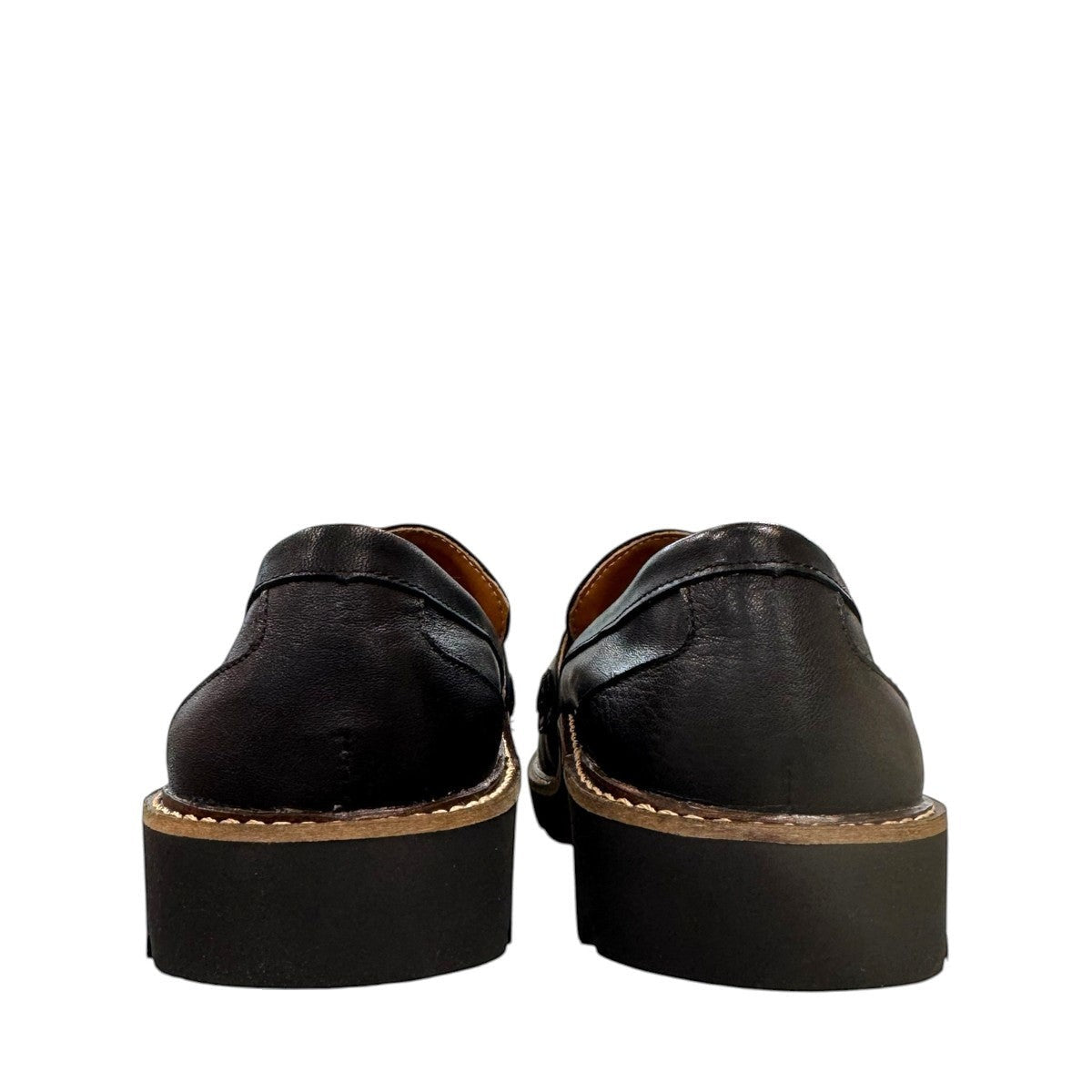 Aetrex Collette black leather loafer showing the durable, lightweight treaded outsole and heel.