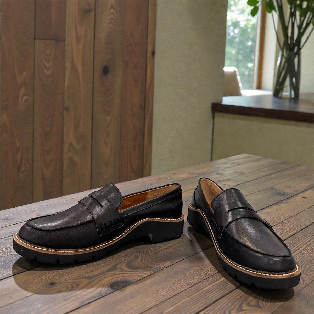 Aetrex Collette black leather loafer showing the durable, lightweight treaded outsole and heel.