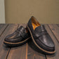 Aetrex Collette black leather loafer showing the durable, lightweight treaded outsole and heel.