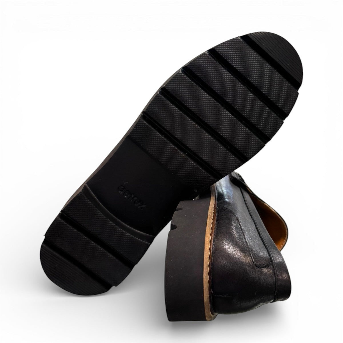 Aetrex Collette black leather loafer showing the durable, lightweight treaded outsole and heel.