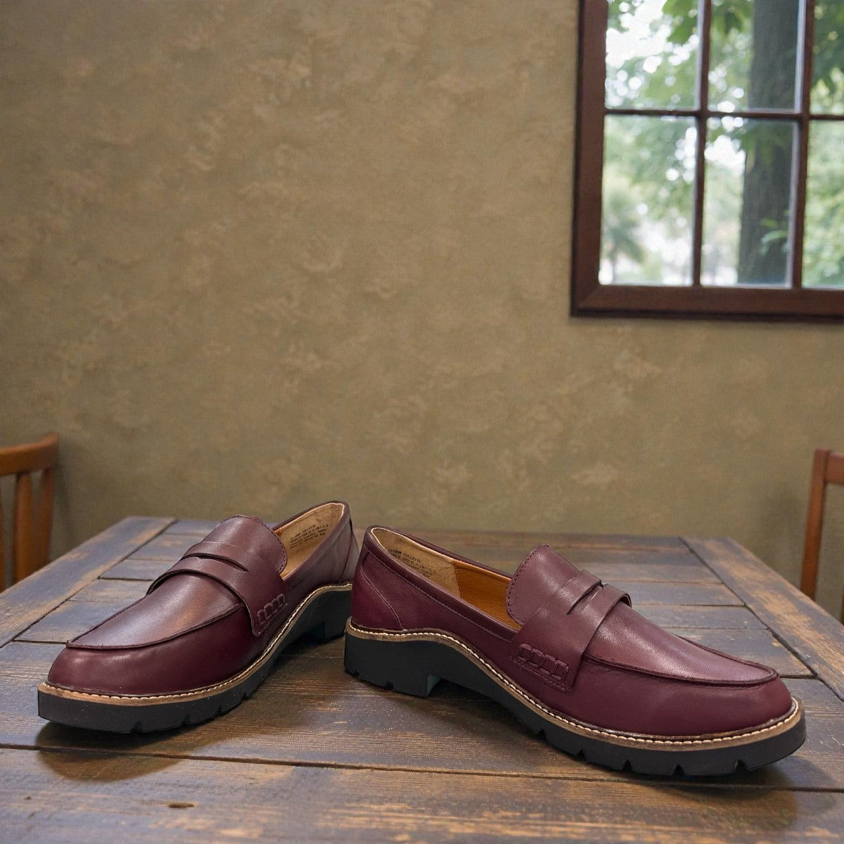 Aetrex Collette burgundy leather loafer showing the durable black lugged outsole and low heel profile.