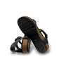 Aetrex Jillian black leather sandal showing the durable rubber outsole and cork midsole detail