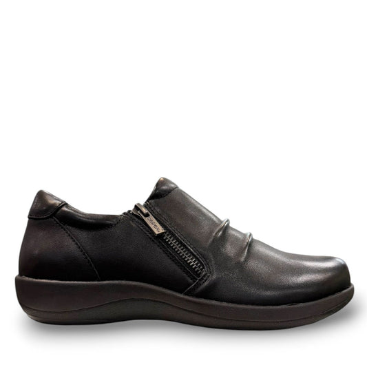Aetrex Katie black leather casual shoe showing the durable rubber outsole and side zipper detail