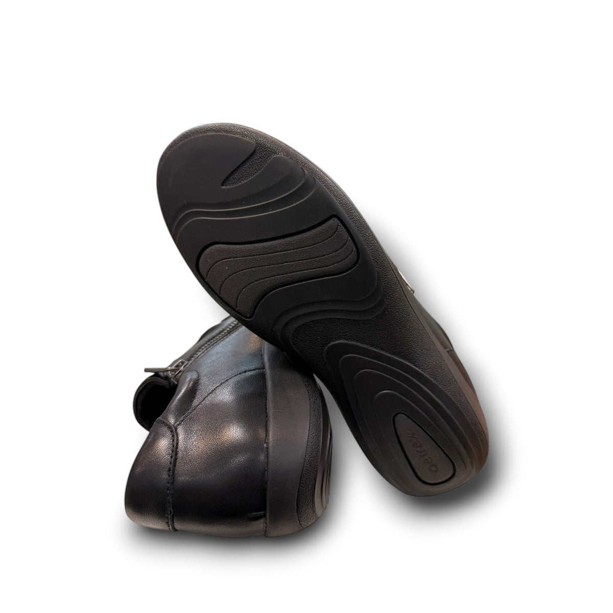 Aetrex Katie black leather casual shoe showing the durable rubber outsole and side zipper detail