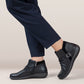 Aetrex Luna black leather ankle boots with pleated detail, side zipper, and adjustable buckle.