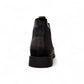 Agera Arta black leather Chelsea boots with elastic side panels and a durable rubber outsole. Photo of back view.