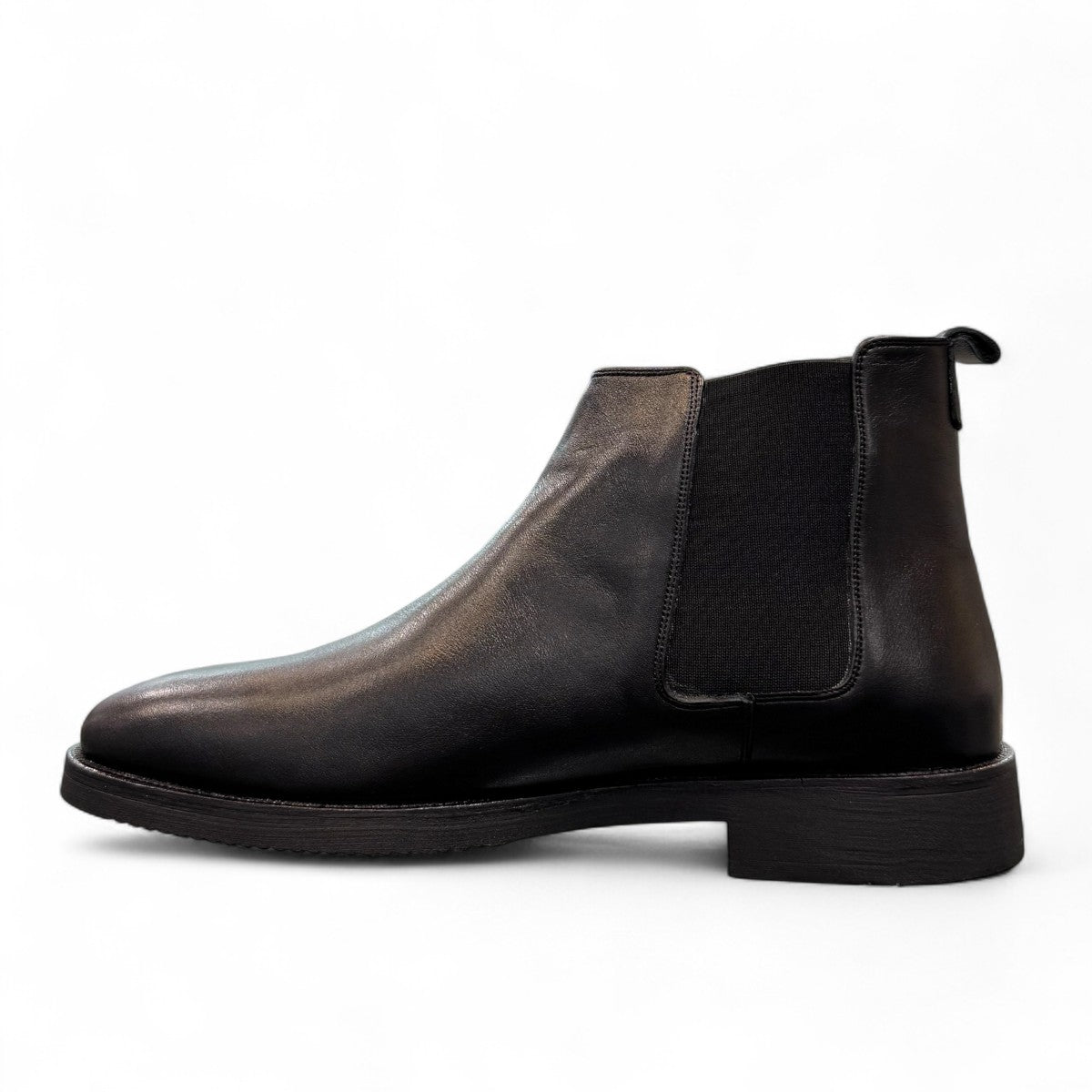Agera Arta black leather Chelsea boots with elastic side panels and a durable rubber outsole. Photo of left side view.