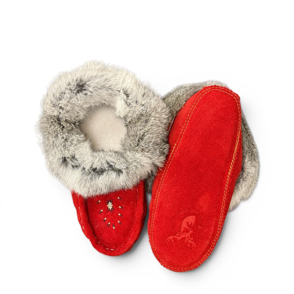 alberta red cowhide suede moccasins with a fluffy rabbit fur ankle collar, handcrafted for cozy comfort.
photo of the bottom side